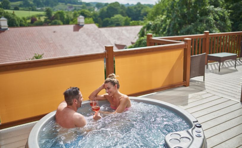Mendip View Lodges coupel in hot tub